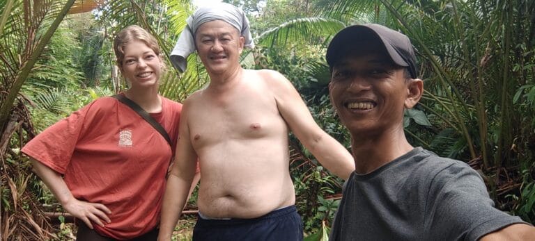 Andrian Salis guiding tour guests through the Siberut jungle on a Mentawai tribe tour