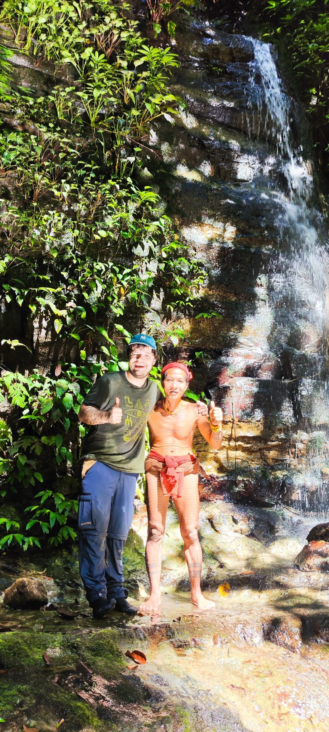 Guest and Sikerei portrait at a hidden waterfall, Mentawai