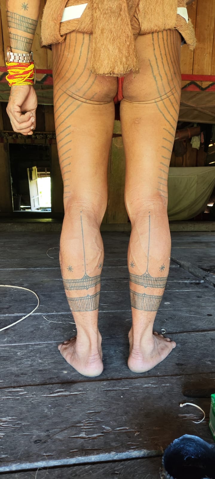 Traditional Mentawai leg tattoo, back view showing ankle motif
