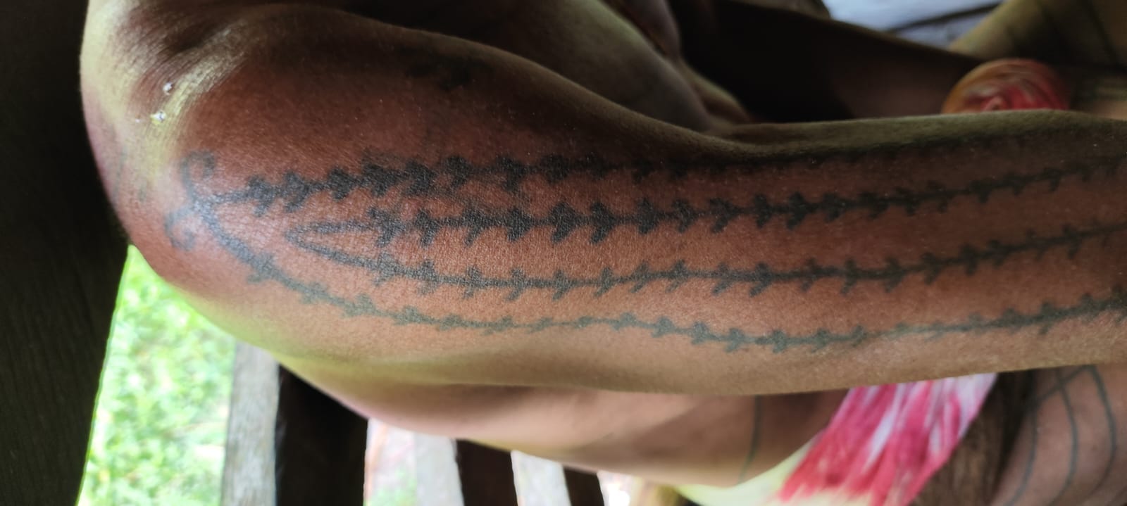 Traditional Mentawai herringbone tattoo motif on forearm