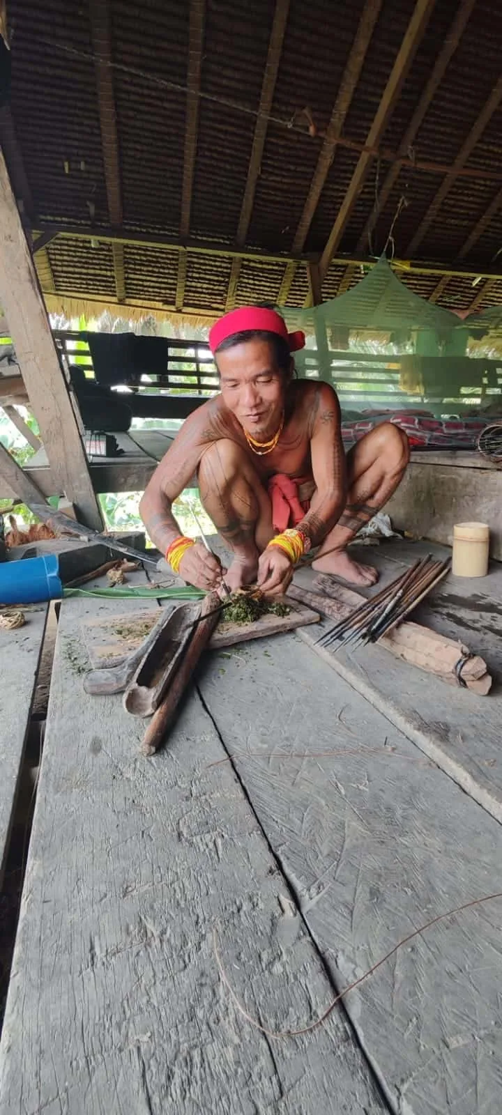 Mentawai Sikerei preparing traditional arrow poison, Siberut Island