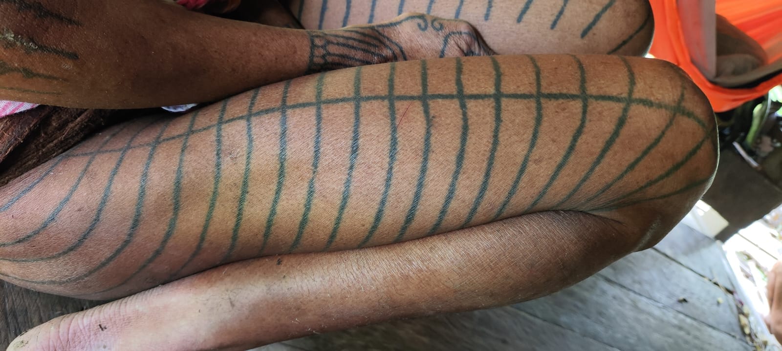Traditional Mentawai geometric grid pattern tattoo on arm